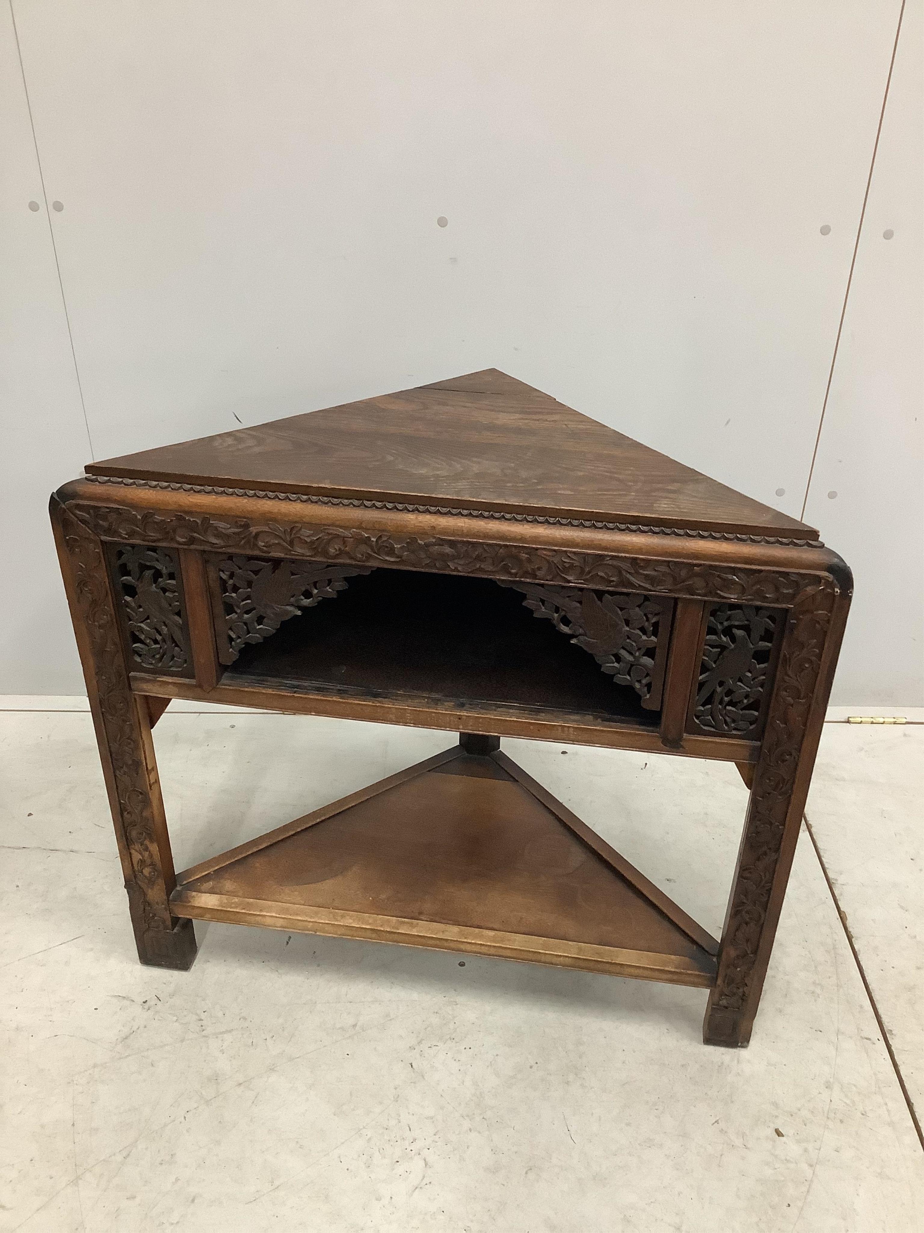 An early 20th century Chinese corner fitting table with later oak top, width 85cm, height 79cm. Condition - fair